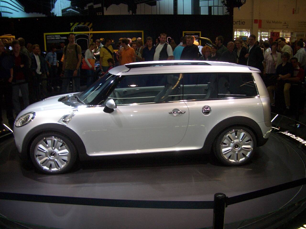 a mini - compact car on display at a vehicle show