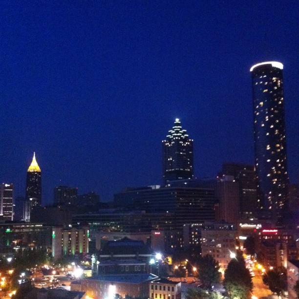 a city with very tall buildings at night