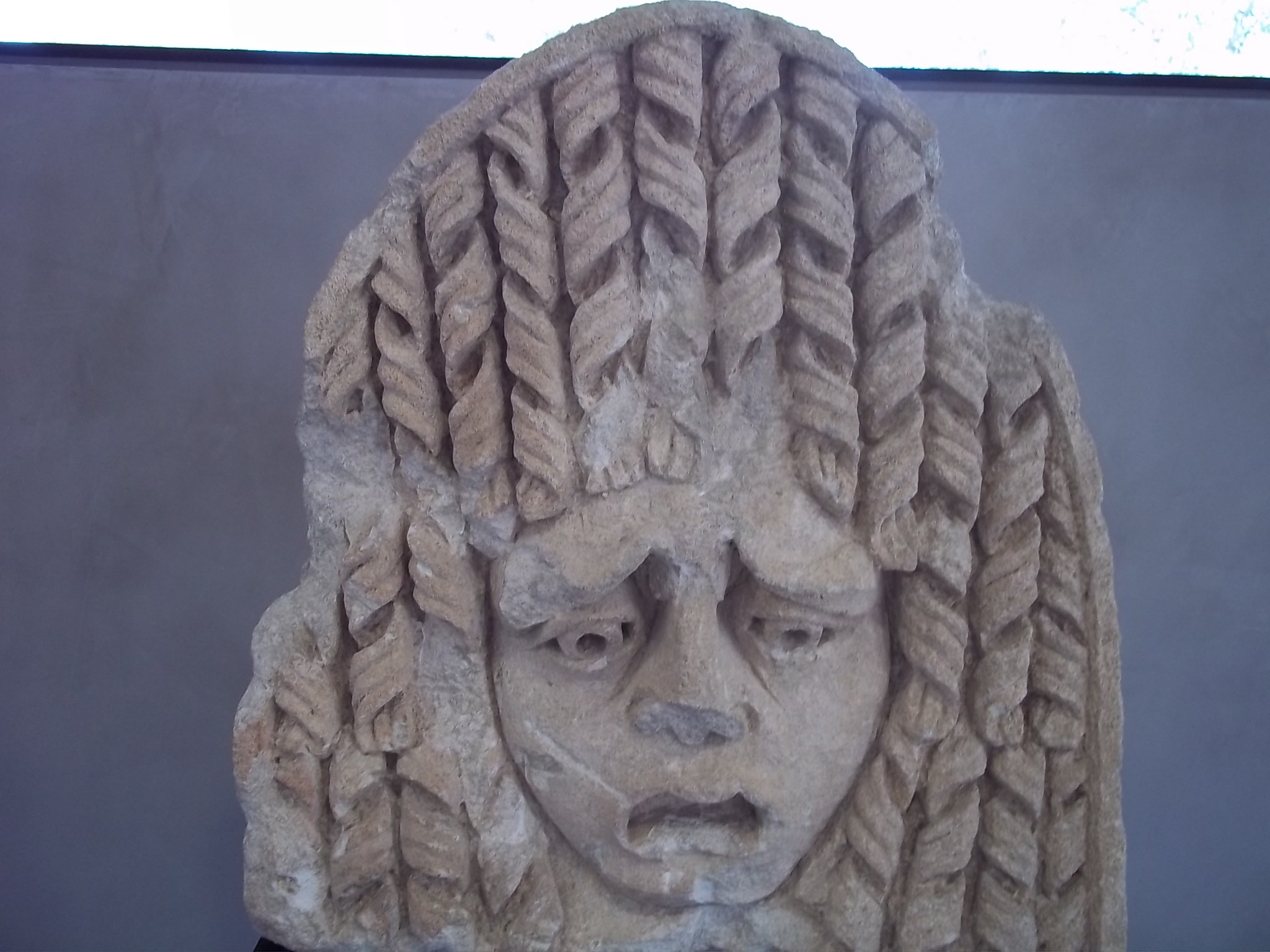 this is an image of a statue with long hair