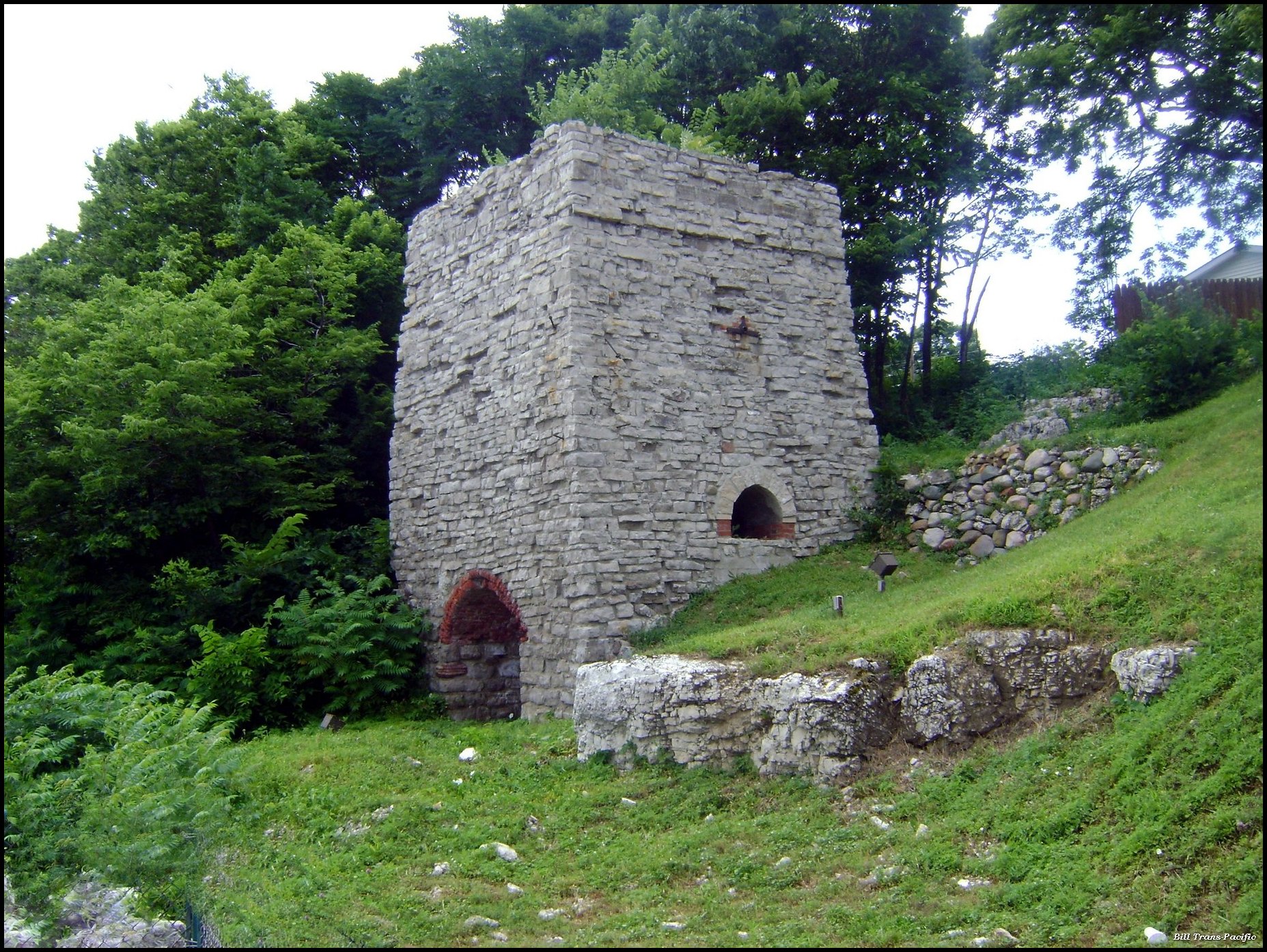 a large stone castle built into the side of a hill