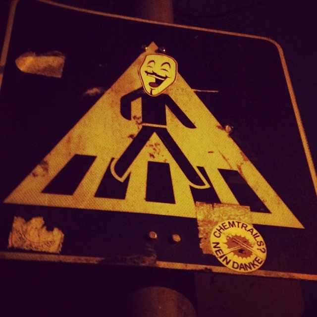 a black and white street sign on a pole