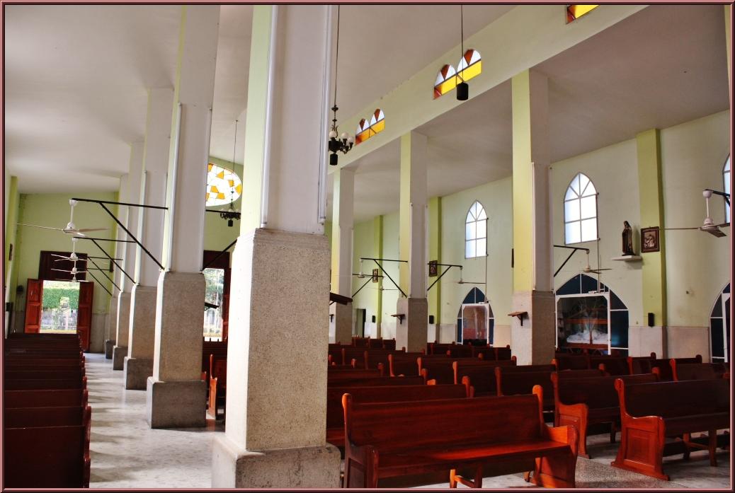 a po inside of a church looking out onto the aisle