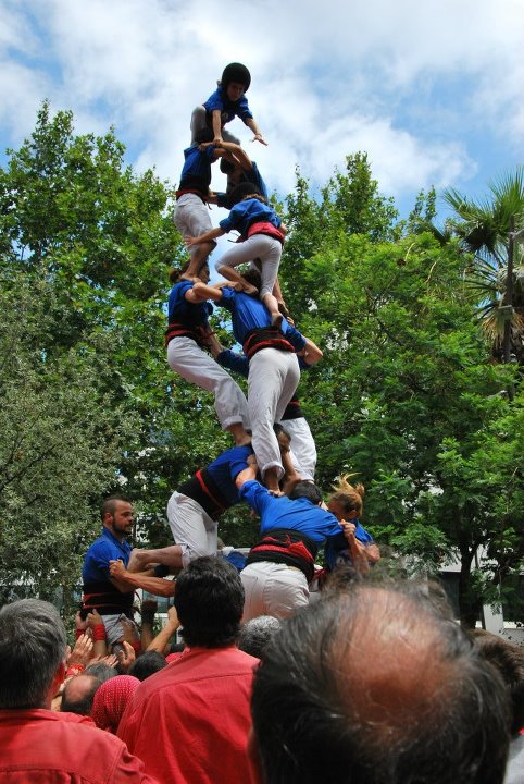 people are performing aerial tricks in front of a crowd