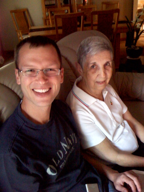 a man and woman are sitting in a couch