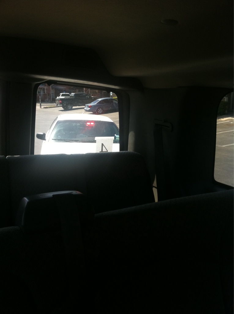 a car parked in the parking lot of an airport