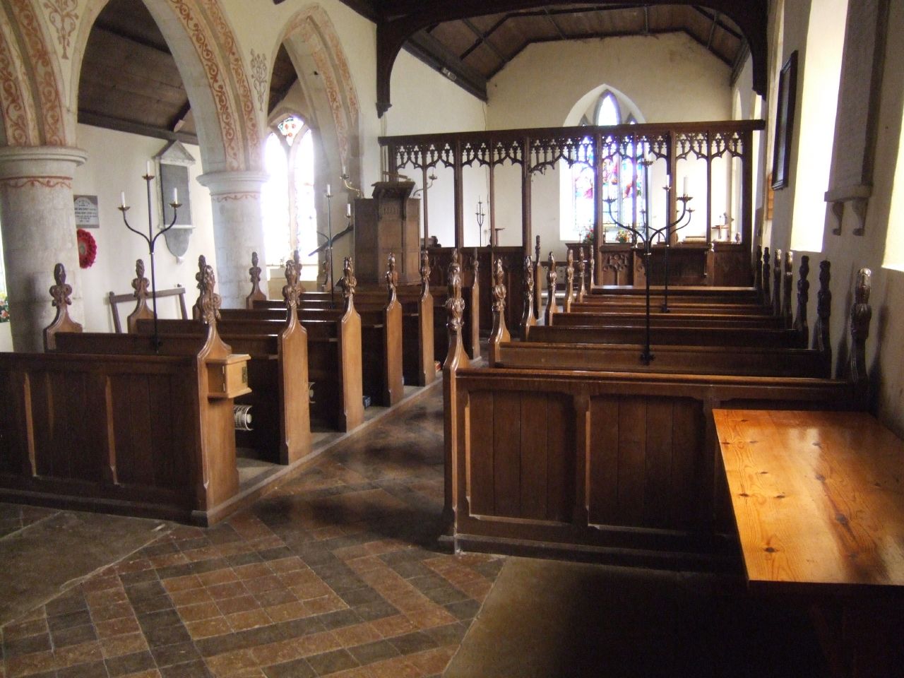 church pews with benches and stained glass windows