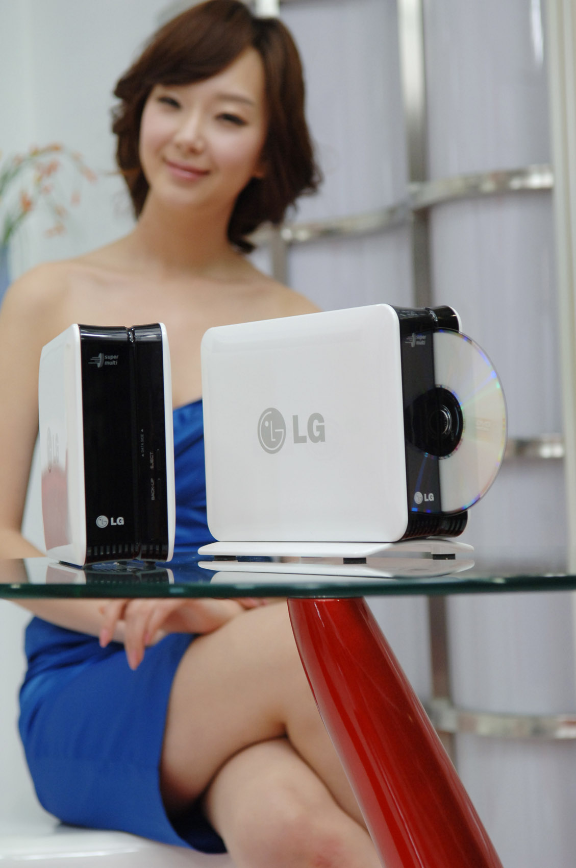 the woman is posing with her small electronic device