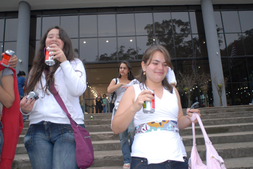 two women who are standing in front of some steps