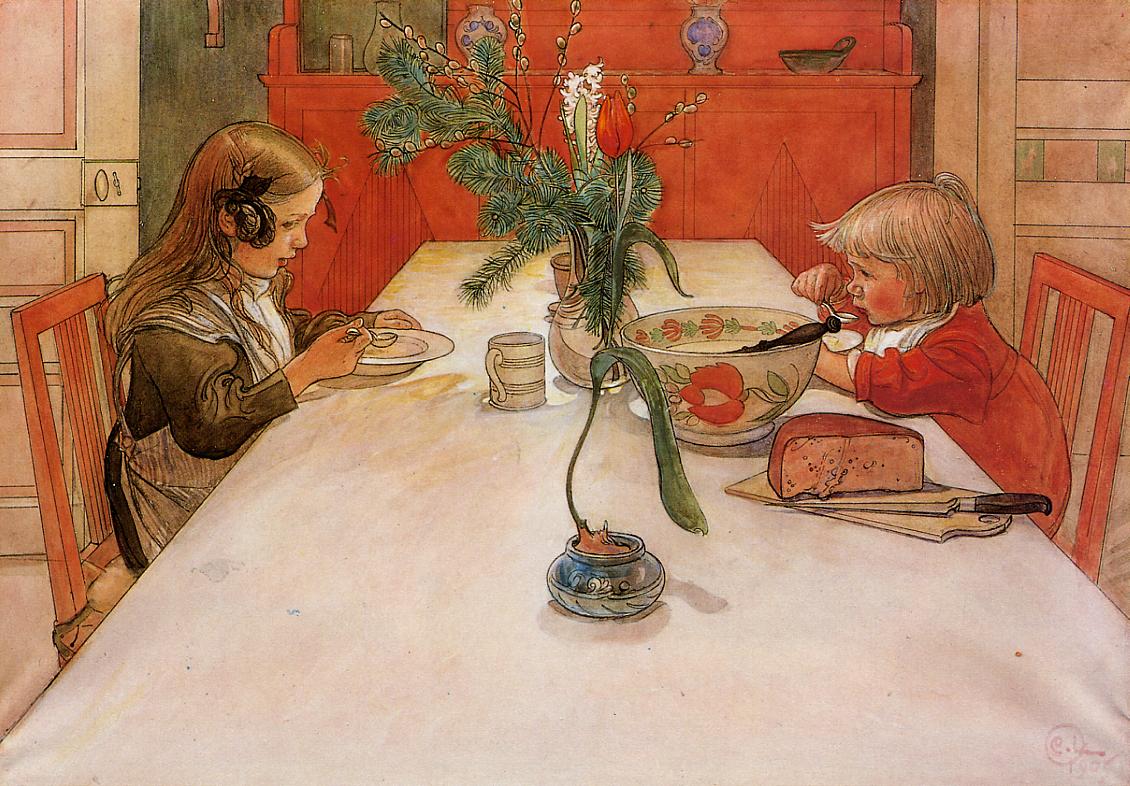 two children are sitting at the table, eating