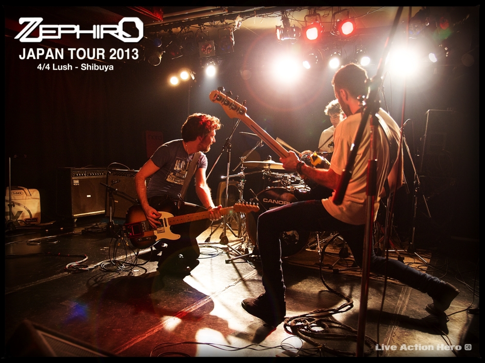 a couple of men sitting on top of a stage