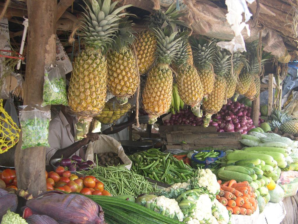 a fruit stand filled with lots of fresh fruits and vegetables