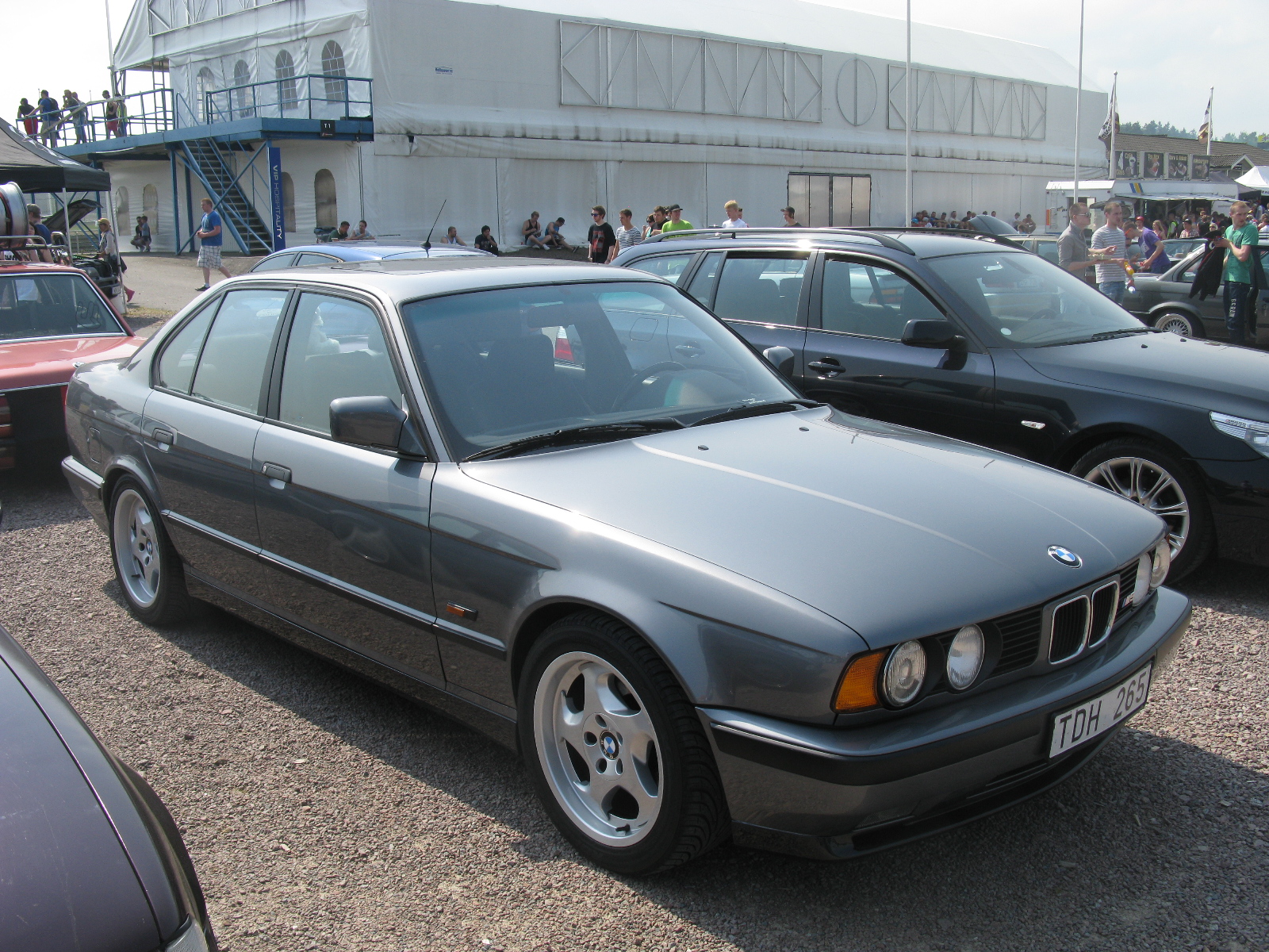 several cars that are sitting in the parking lot