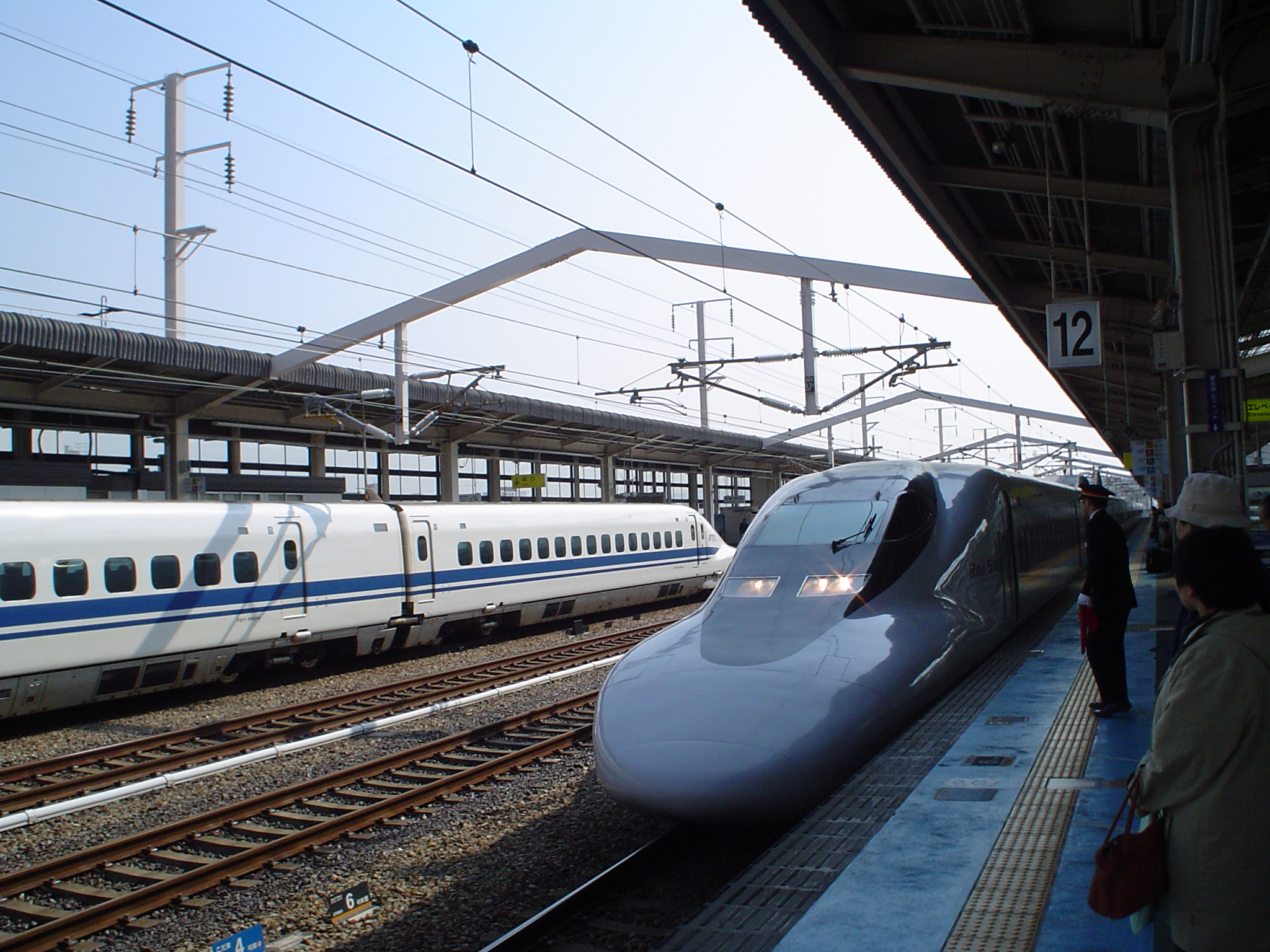 there is a high speed train pulling into the station