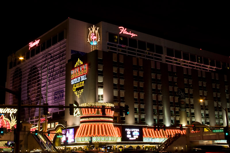 a colorful el and casino at night lit up