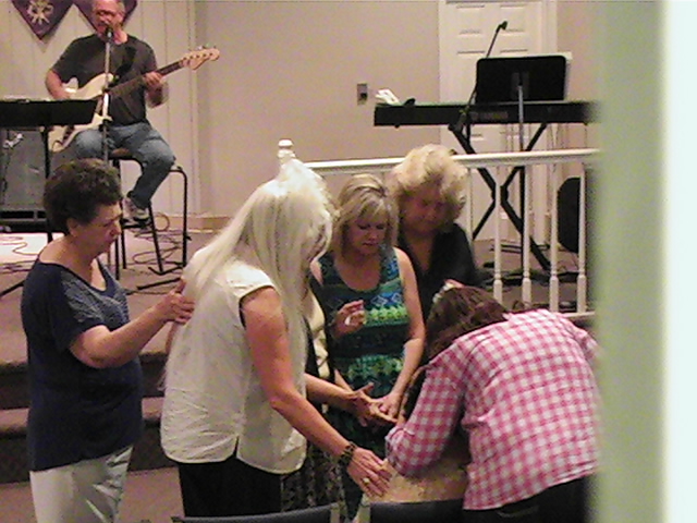 people gather in a room with guitars, drums and bassets