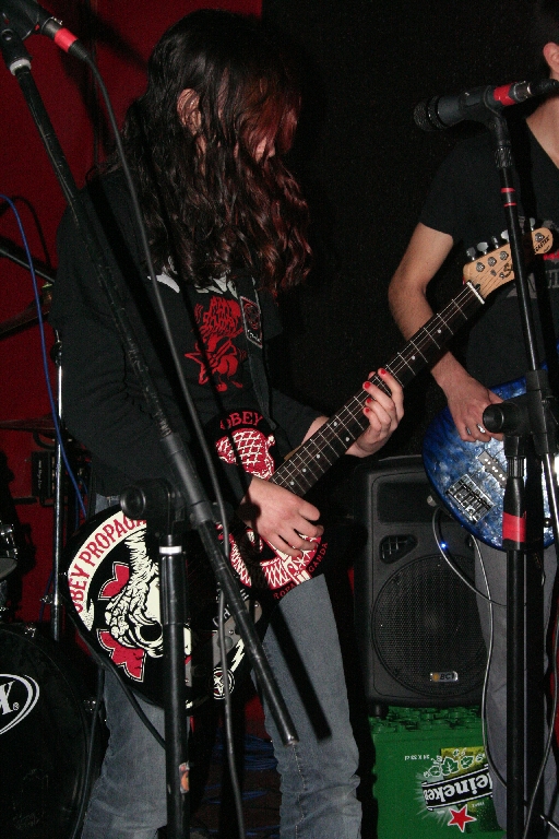 two people are playing instruments on stage