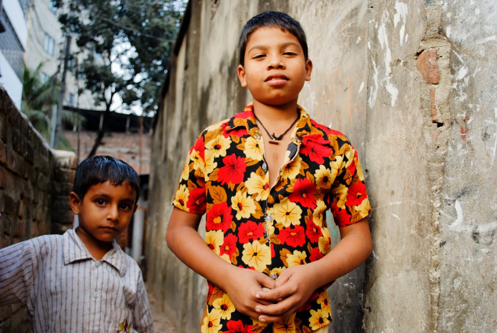 a boy and girl standing next to each other