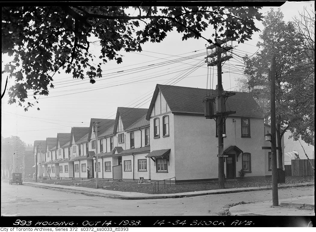 an old po of some houses in a neighborhood