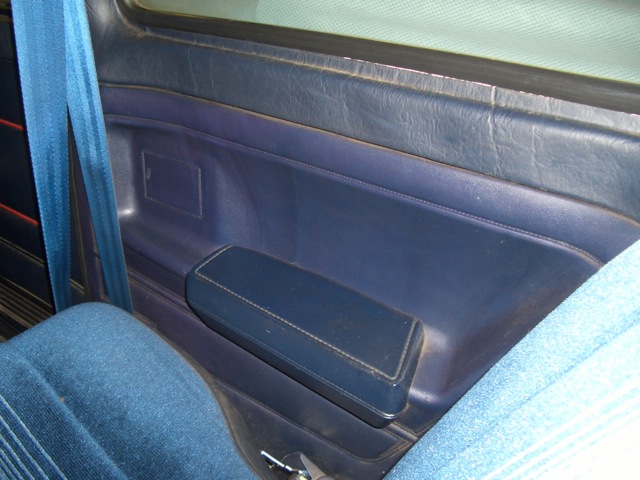 a car door with the console panel partially open