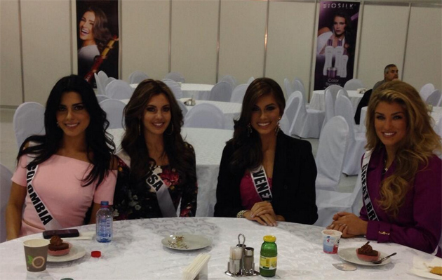 the women have been posing for the cameras at the banquet table