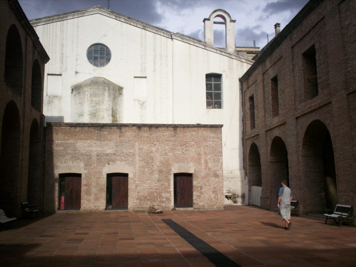 a large white building with two doorways