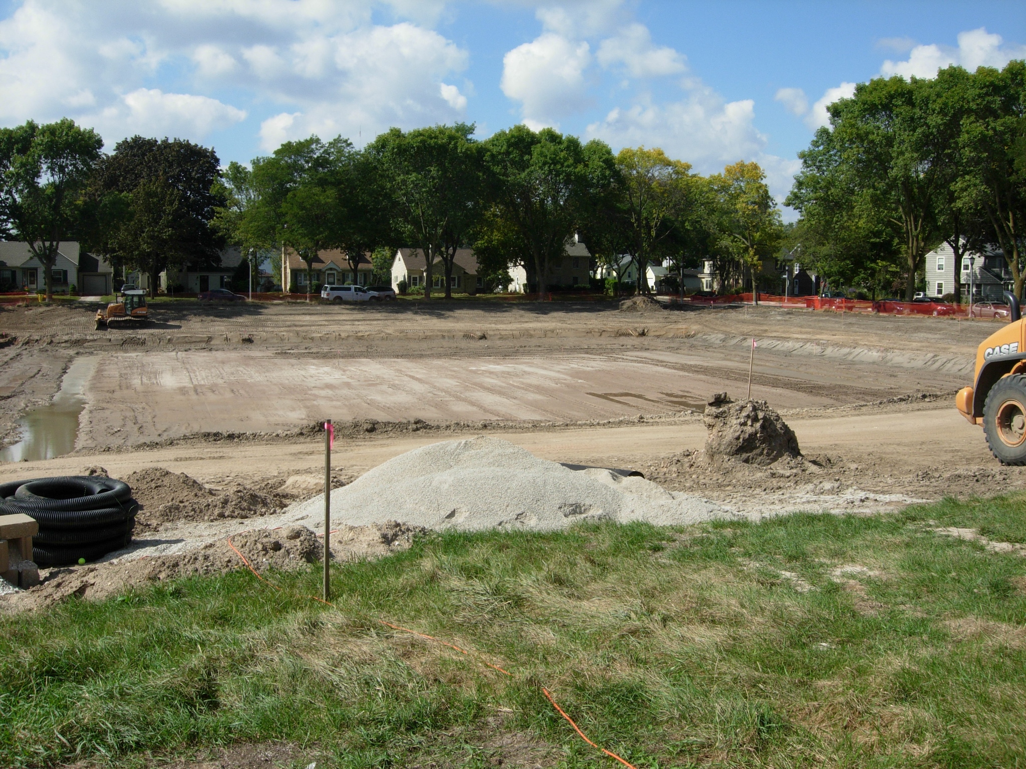 a construction site with a huge bulldozer digging