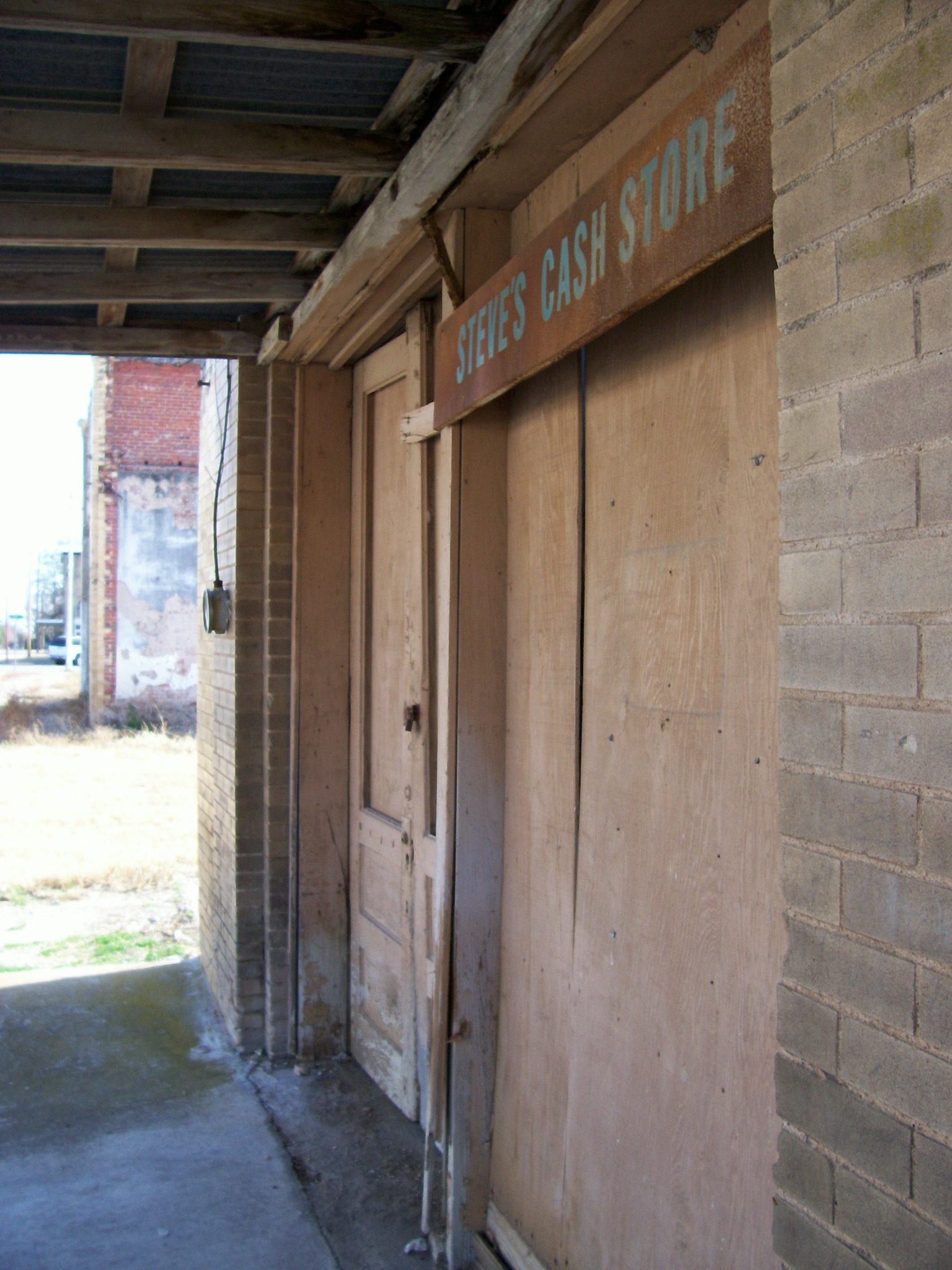 a store sign and some brick walls