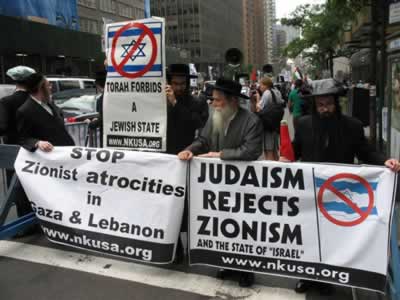 a group of men hold signs on the streets