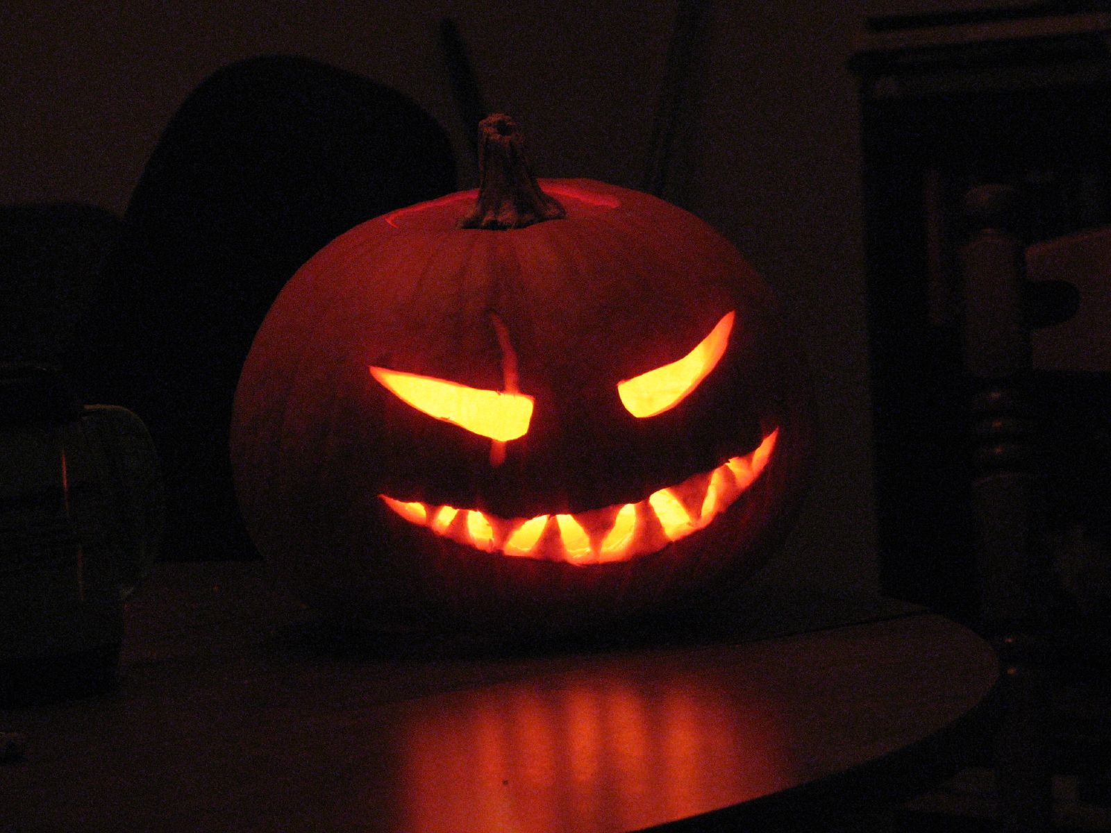 a carved jack o lantern in the dark