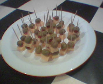 a plate filled with small appetizers on top of a table