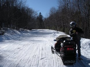 a person on a snowmobile in the snow
