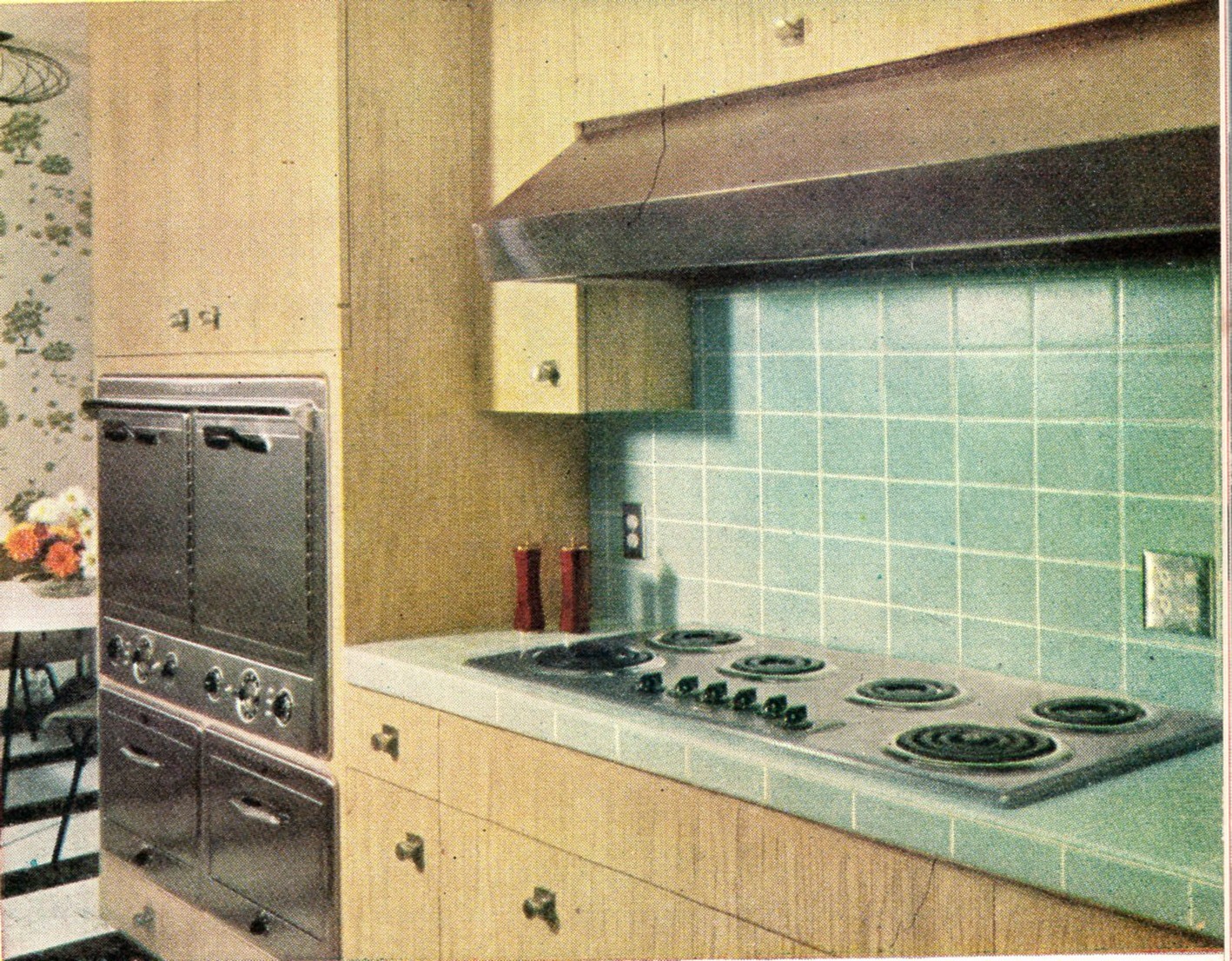 kitchen with stove, oven, and dining table