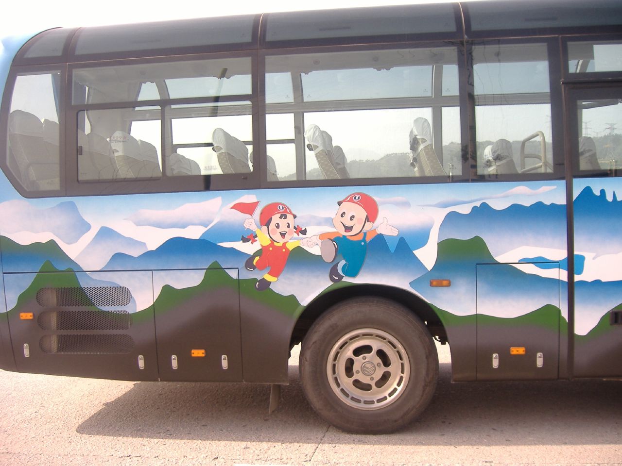 a large bus that has a painting on it
