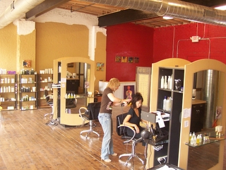 this is a salon with an individual getting their hair done