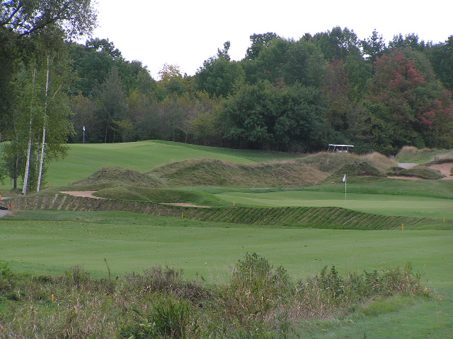 the 13th green of a large open golf course