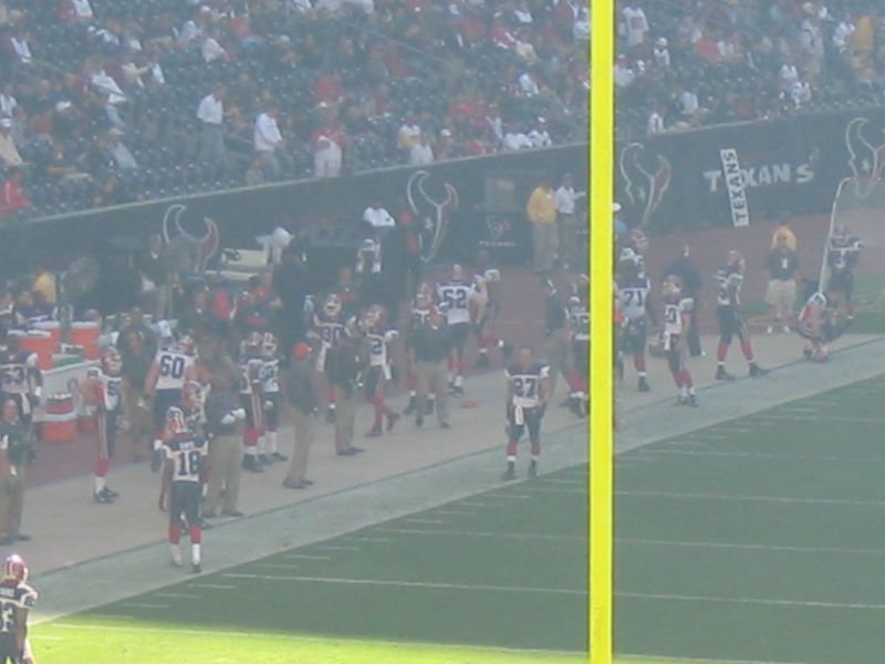 a football player throwing a ball on the field