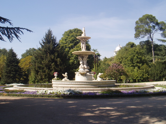a fountain in the center of a park