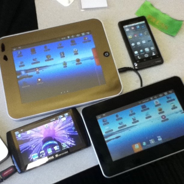 three devices laying on top of a table