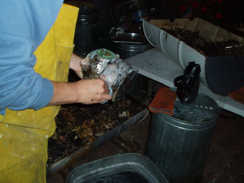 a person pulling food out of a tub