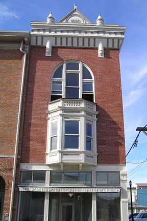 a po of a brick and glass building with multiple stories