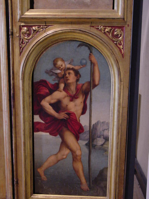 a painting on the wall of a man holding a metal pole