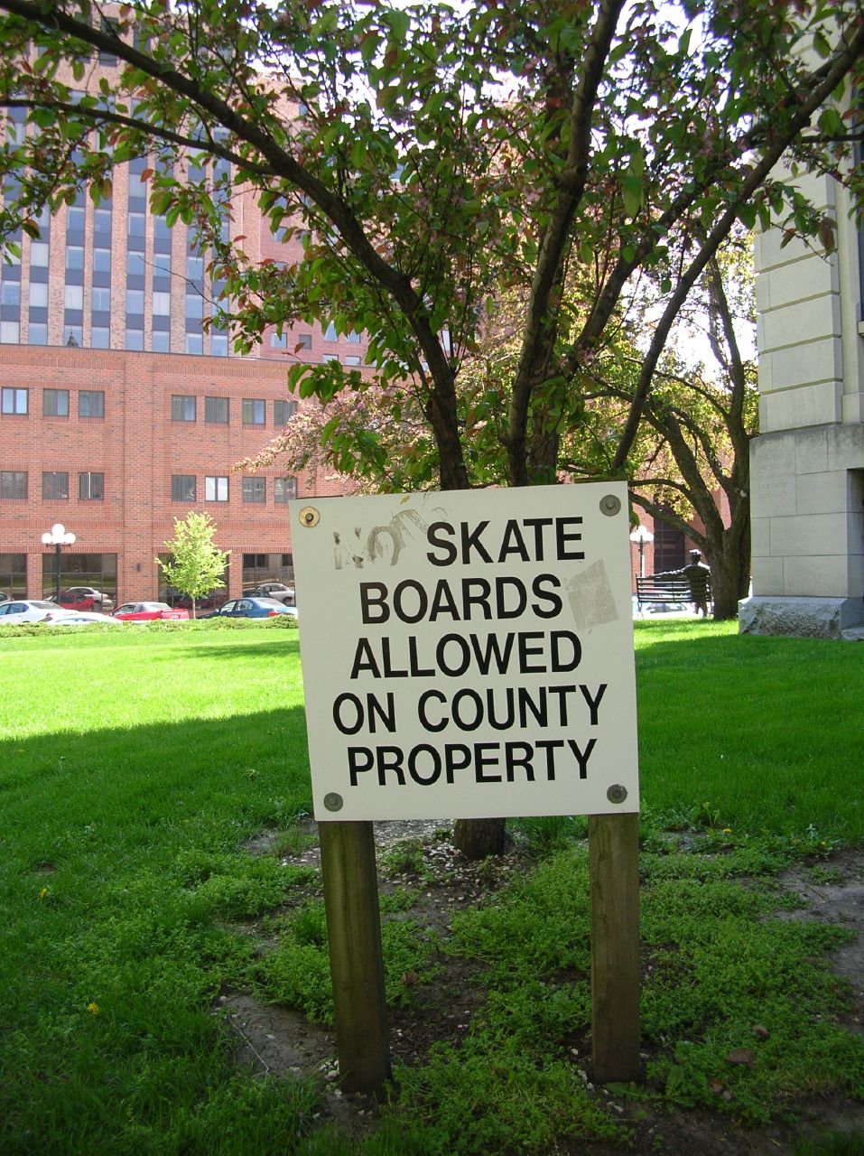 a sign that says skate boards allowed on county property