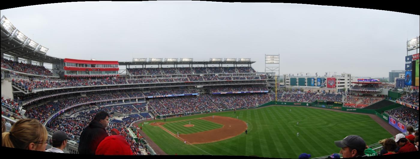 a stadium filled with lots of people during a baseball game