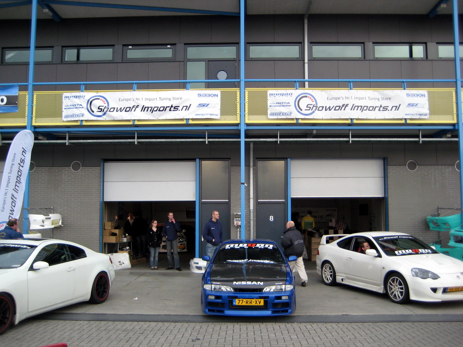 three police cars parked in front of a building