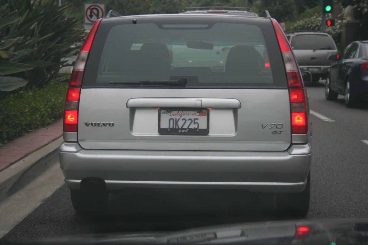 the rear of a silver suv with its license plate