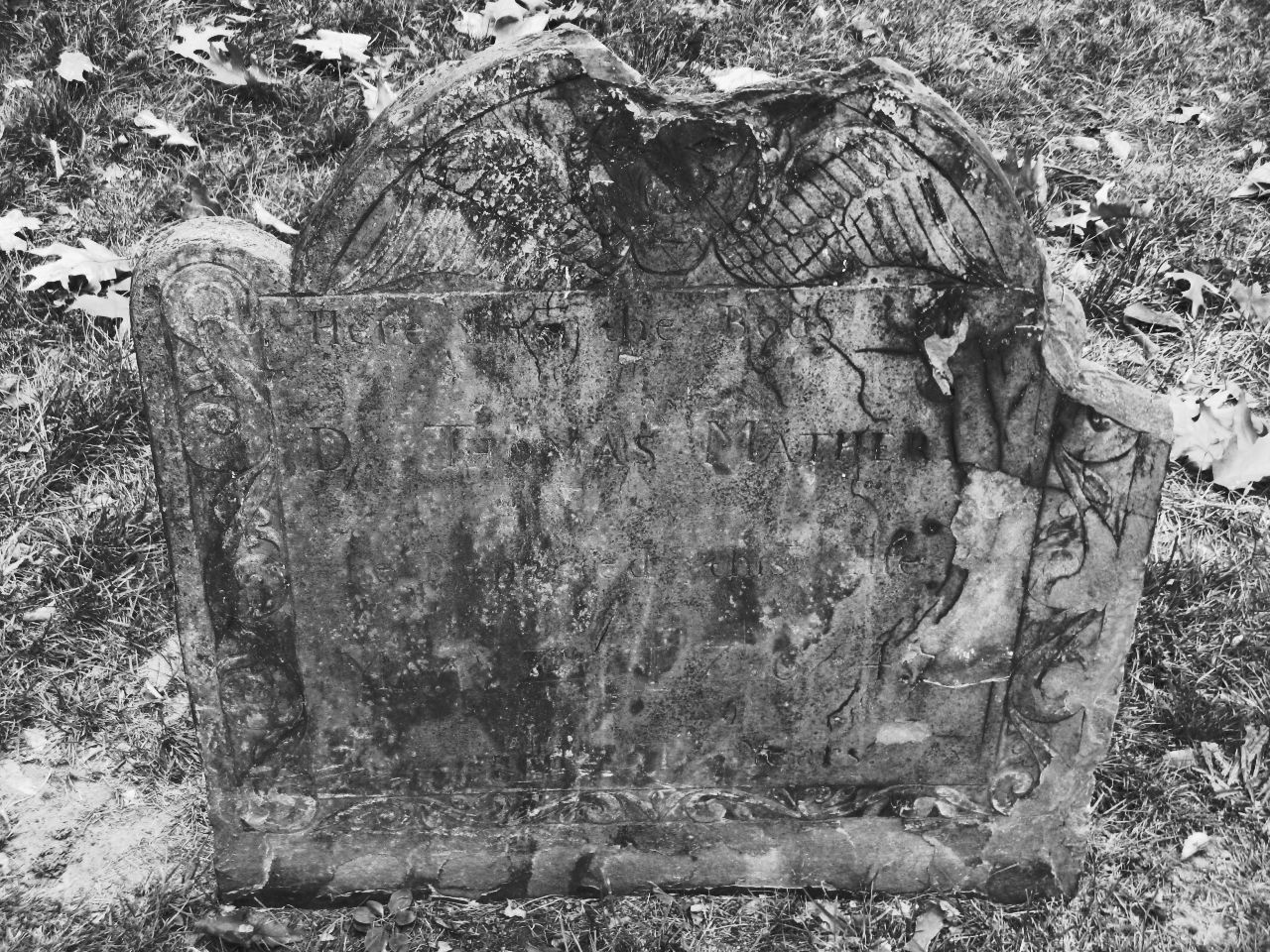 a black and white po of a tombstone