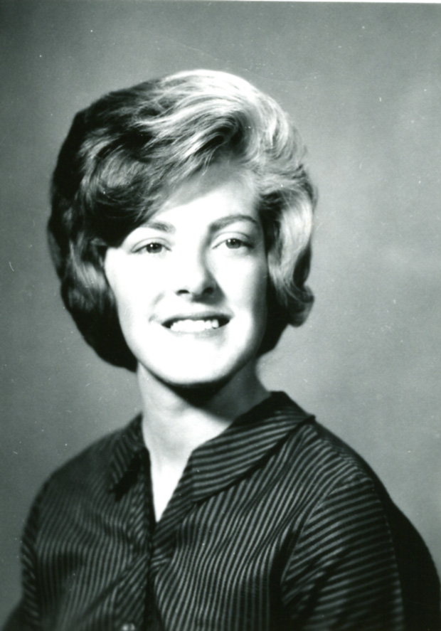 an old black and white po of a woman smiling