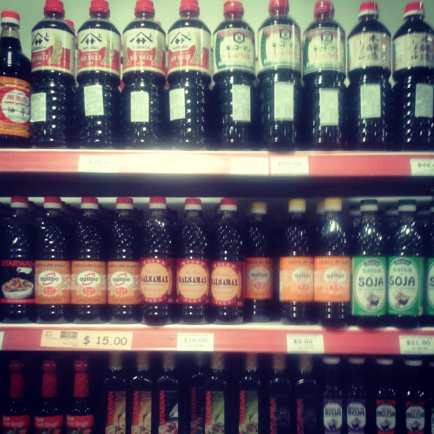 an aisle with a large variety of beer bottles
