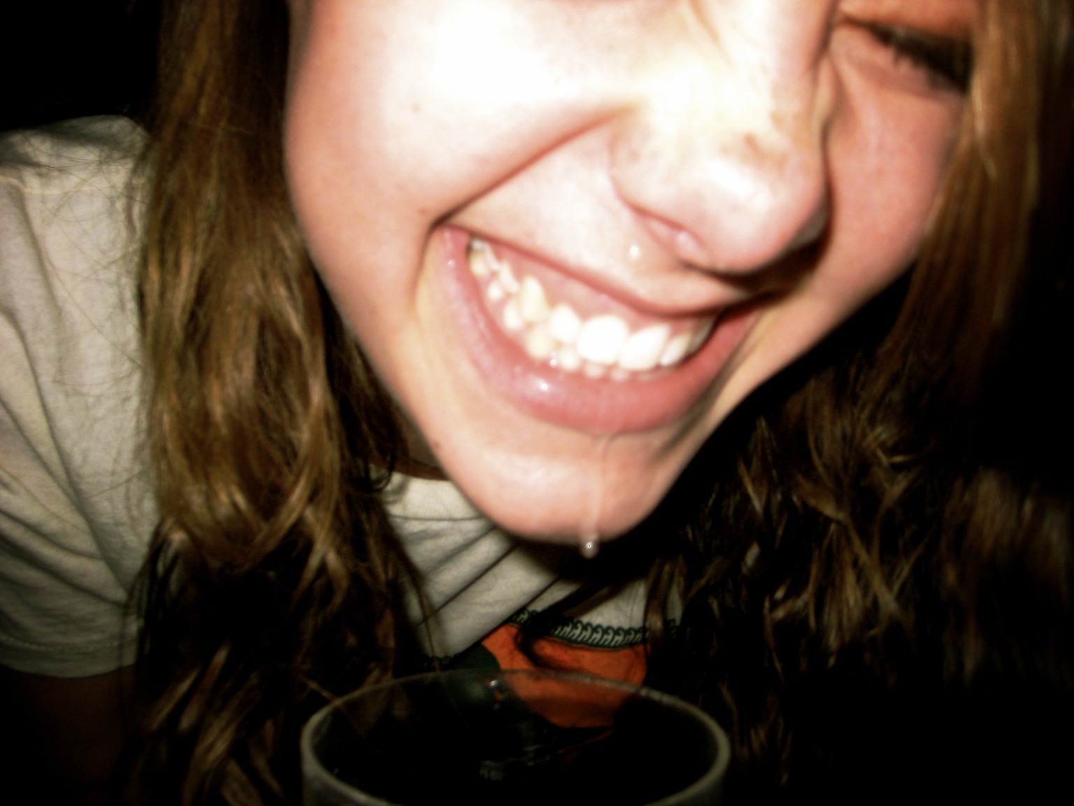 a close up of a young woman with long hair