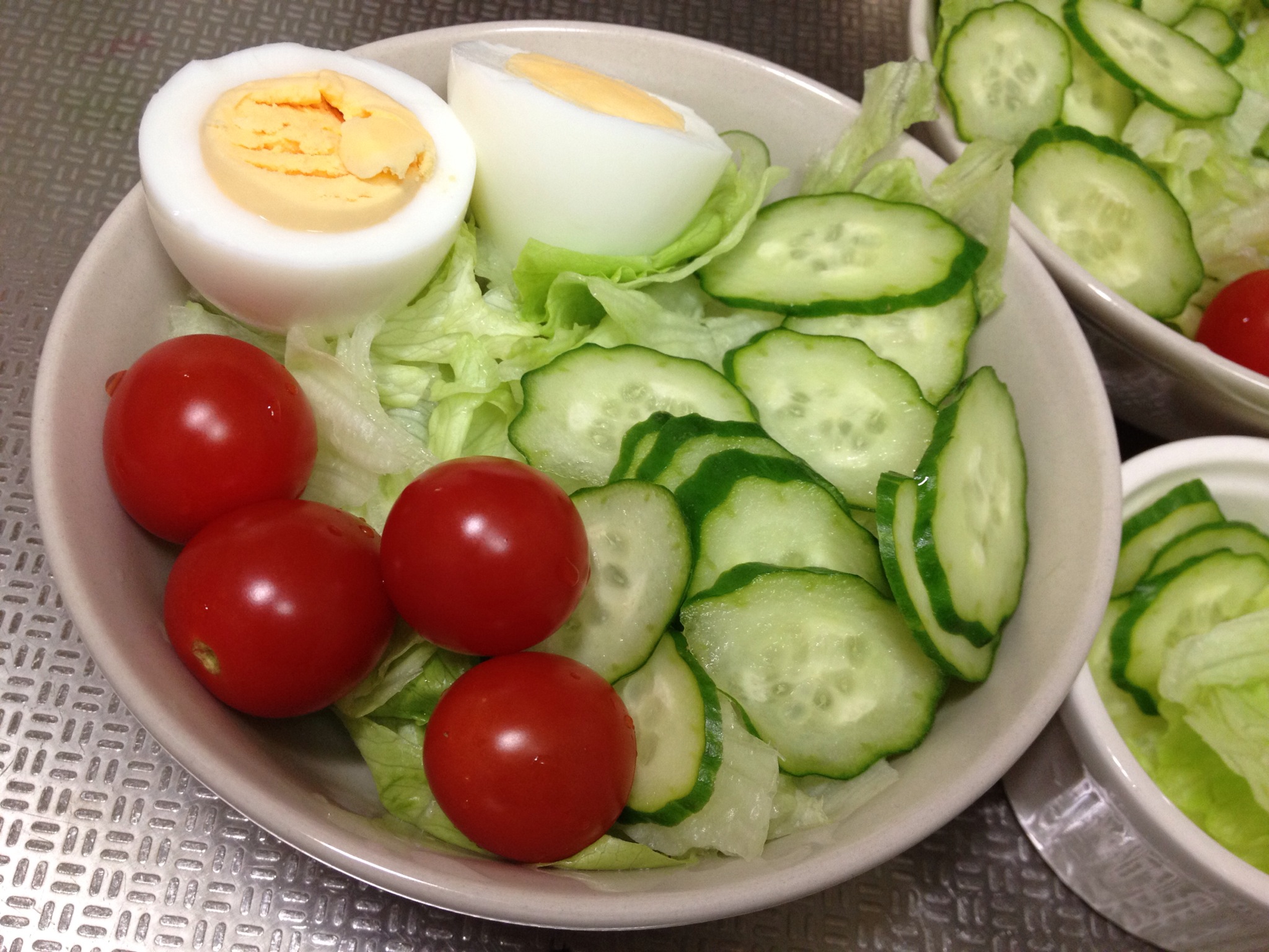 bowls filled with vegetables and hard boiled eggs